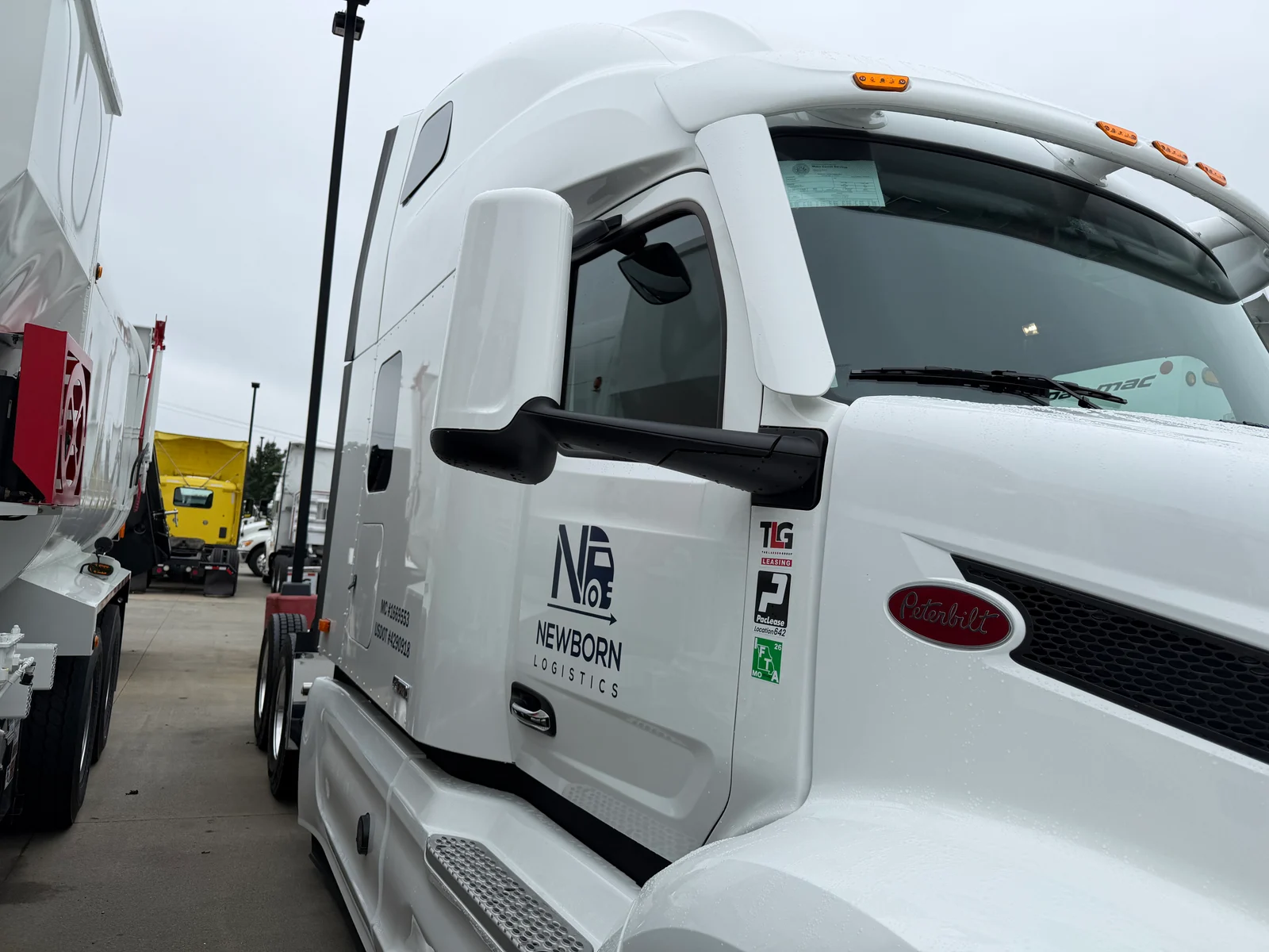 Newborn Logistics Peterbilt cab with original company branding and operating identifiers